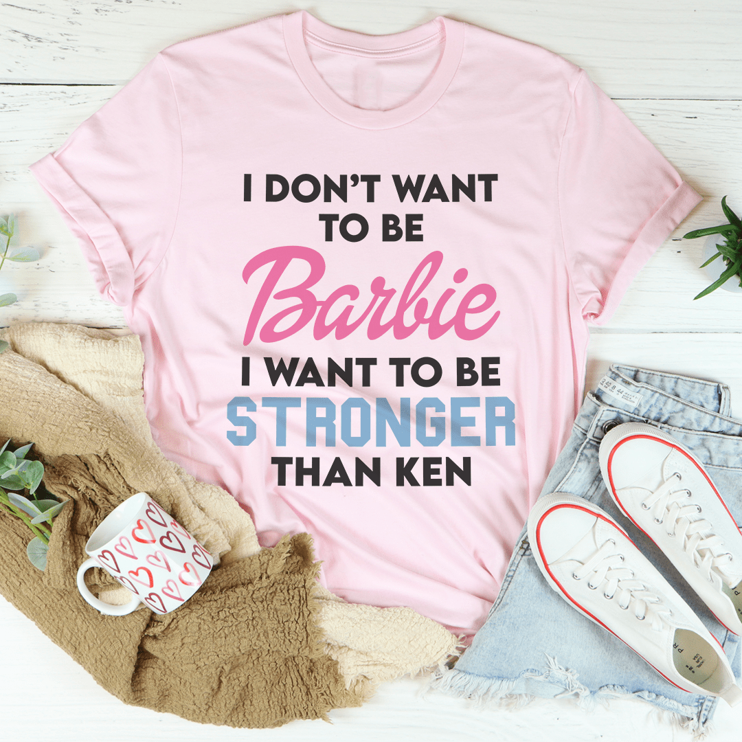 Pink crew-neck T-shirt with Barbie slogan: STRONGER THAN KEN.