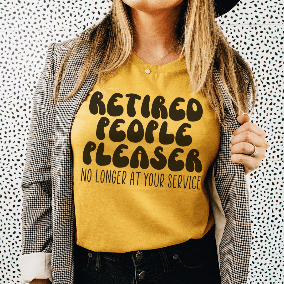 Mustard yellow slogan T-shirt: "Retired People Pleaser" with "No longer at your service"