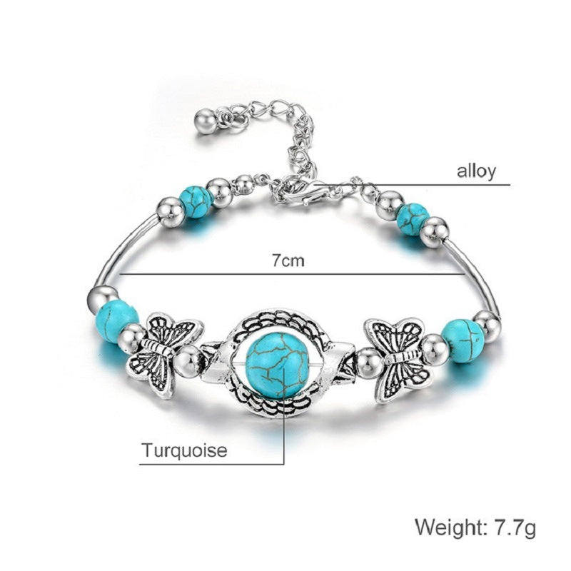 Turquoise bead bohemian bracelet with silver-tone chain, butterfly charms, medallion