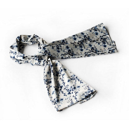 White silk scarf with blue plum blossom print, long drape and tied ends