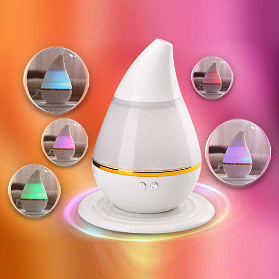 White aromatherapy humidifier diffuser with inset views of blue, purple, pink, and green glow