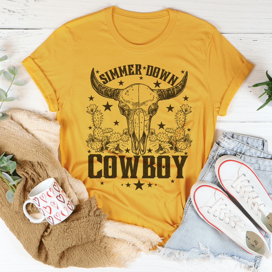 Mustard cowboy T-shirt with bull head and “Simmer Down” graphic on the front