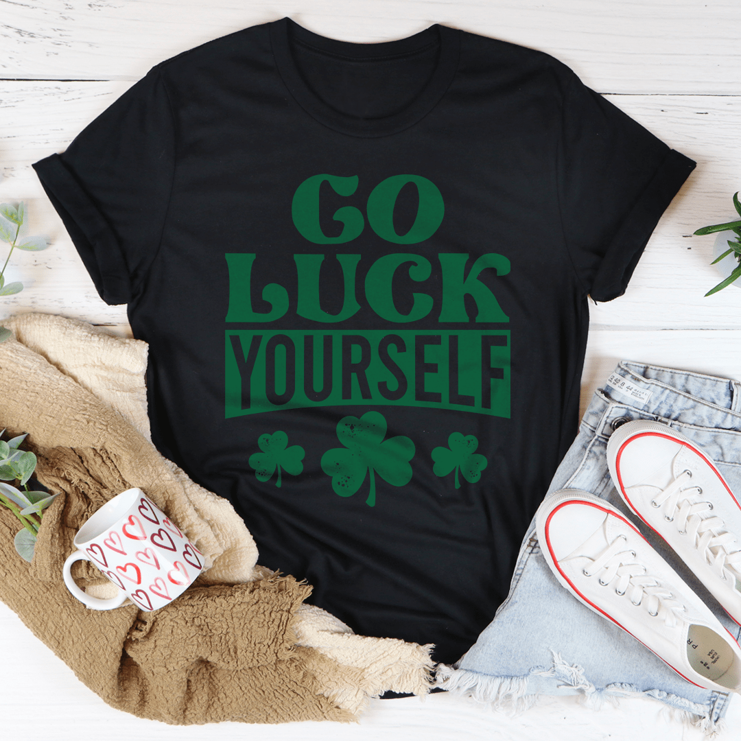 Black graphic t-shirt with green 'Go Luck Yourself' slogan and clover print, crew neck