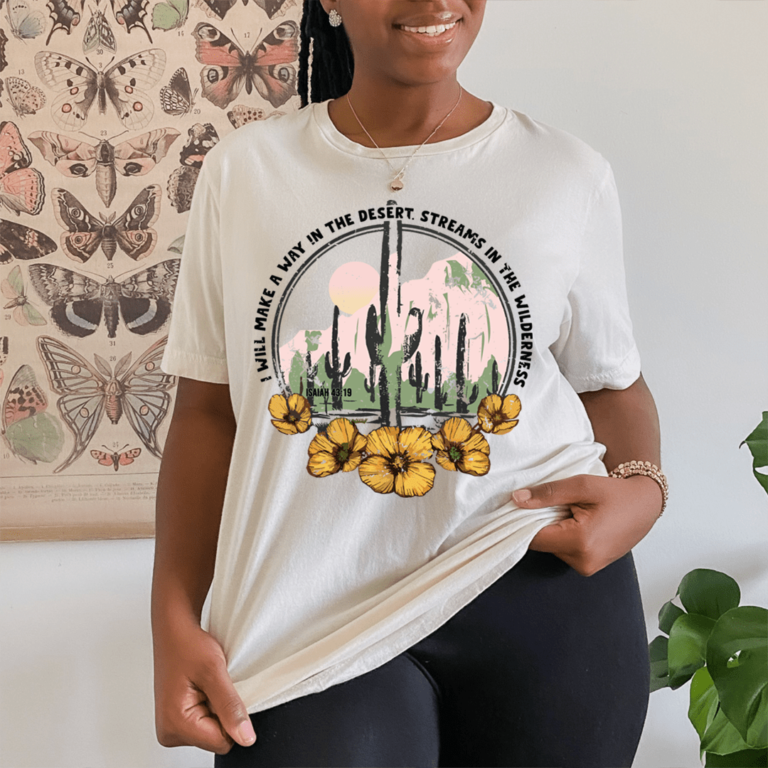 White crewneck short-sleeve T-shirt with desert cactus, sun, and yellow flowers graphic