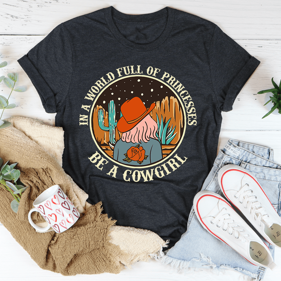 Dark grey cowgirl graphic T-shirt with cowboy hat, cactus, and slogan