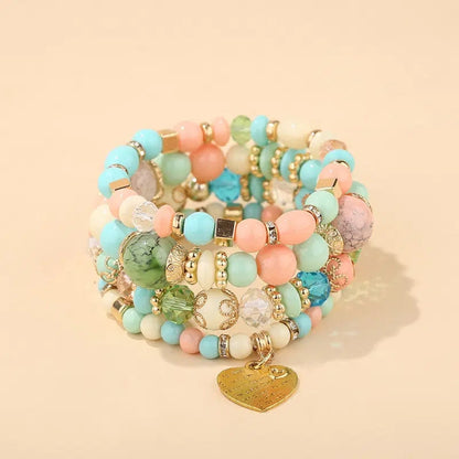 Pastel blue, green, and pink bead layered bracelet set with gold heart charm