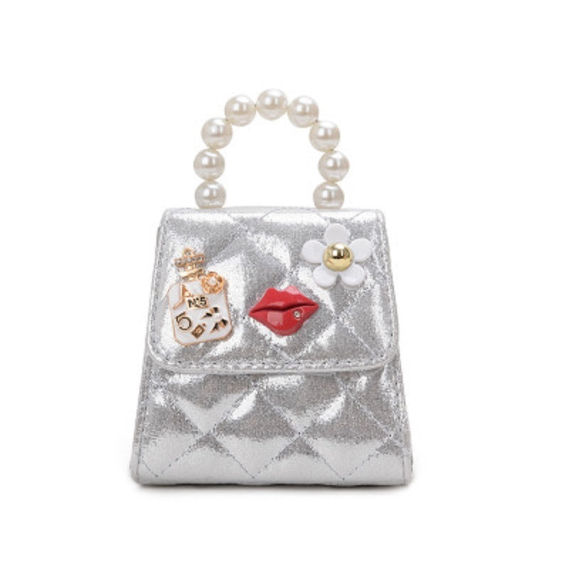 Kids mini crossbody bag in silver with pearl top handle and decorative charms