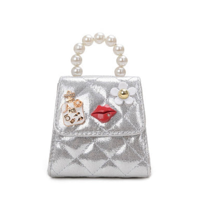 Kids mini crossbody bag in silver with pearl top handle and decorative charms