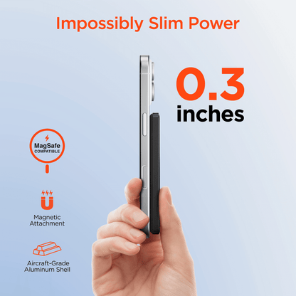 Black slim magnetic power bank held side-on, ultra-thin profile