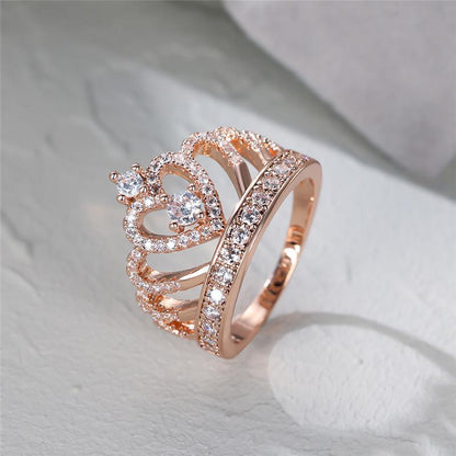 Heart crown promise ring in rose gold with clear pavé stones and central heart.