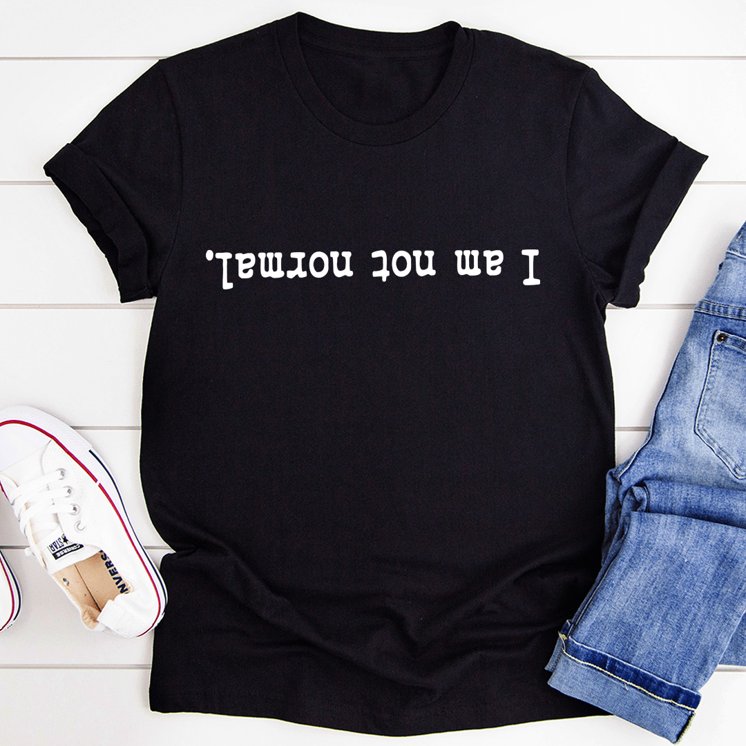 Black crew-neck T-shirt with 'I am not normal' front graphic text