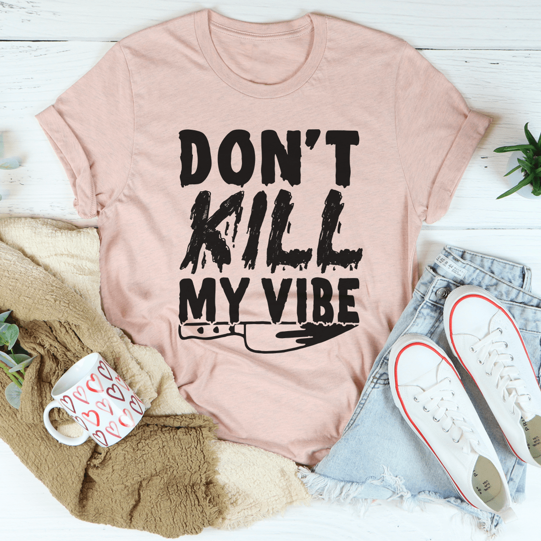 Pink graphic t-shirt with "DON'T KILL MY VIBE" text, crew neck, short sleeves