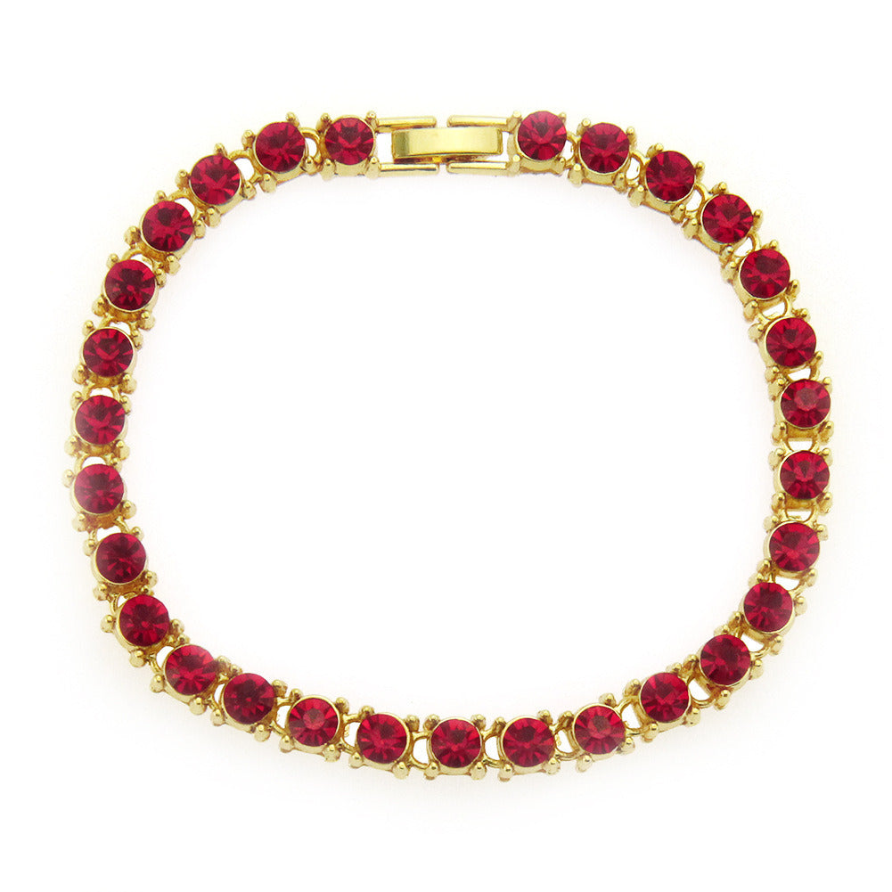 Red rhinestone link bracelet with gold-tone rectangular clasp and round stones