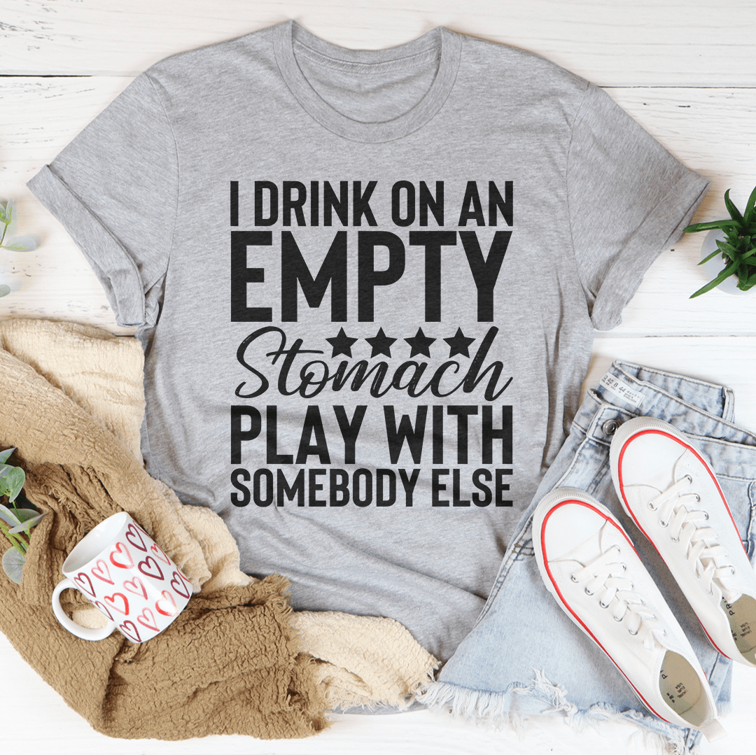 Heather gray crewneck t-shirt with large stacked text: "I DRINK ON AN EMPTY Stomach PLAY..."