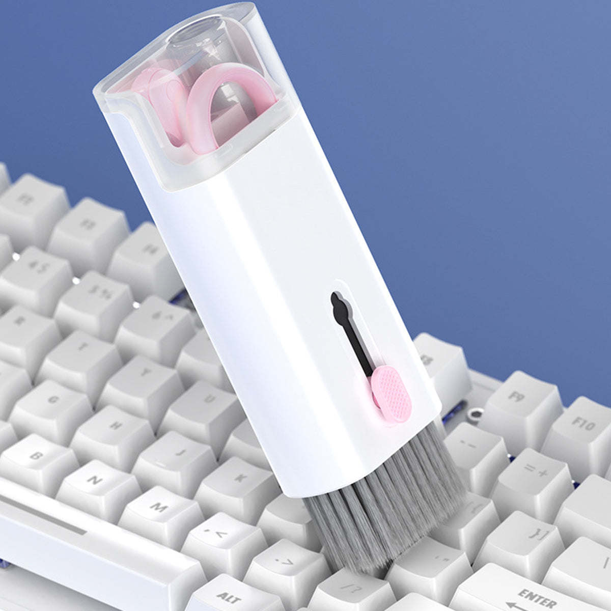 White and pink keyboard cleaning brush with gray bristles