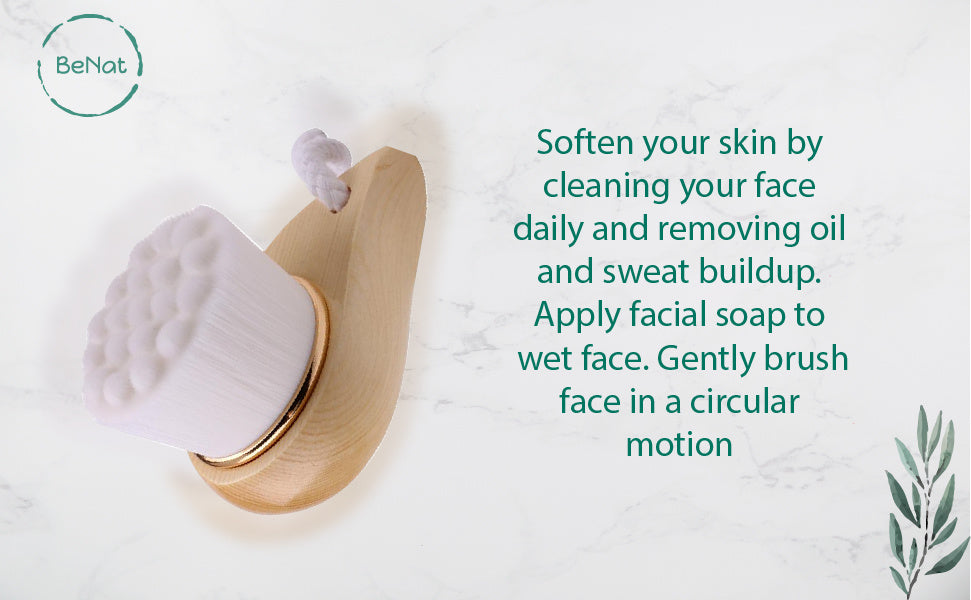Facial brush with bamboo handle and soft white round head with small knob.