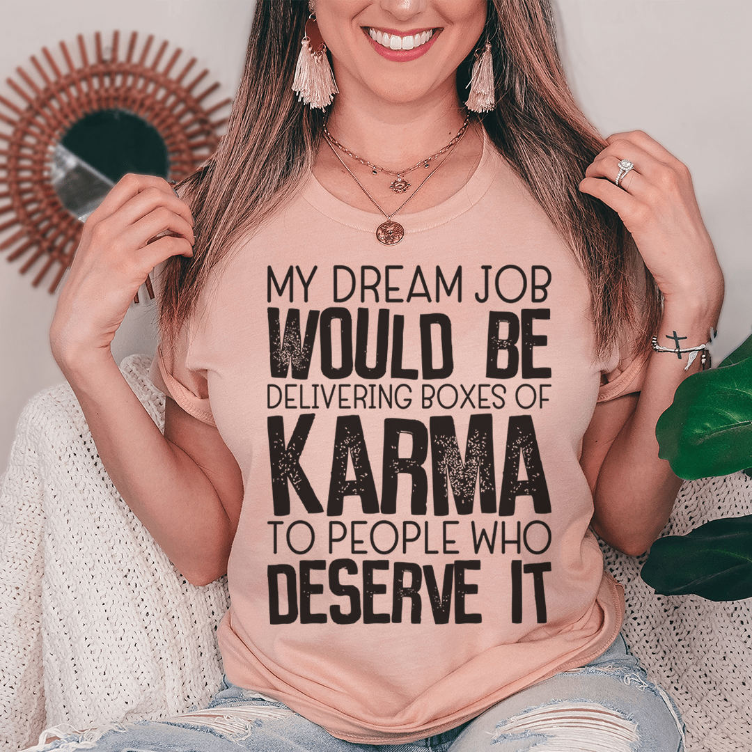 Dusty pink crewneck T-shirt worn by model with KARMA slogan front