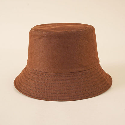 Women's dark brown bucket hat with eyelet-stitch brim and round crown