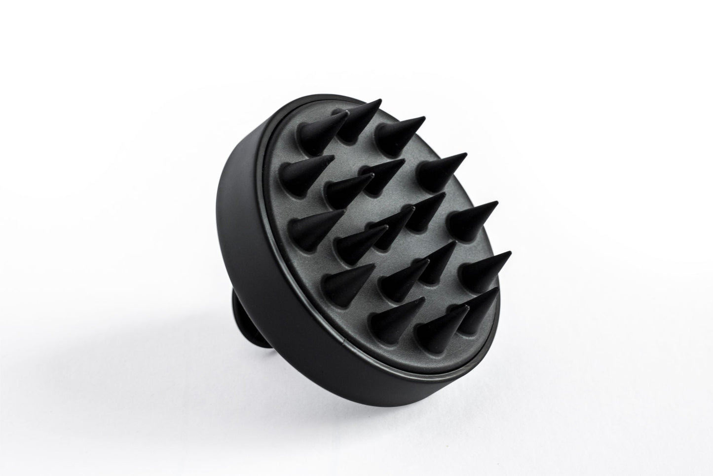 Black scalp massager head with flexible massage nubs