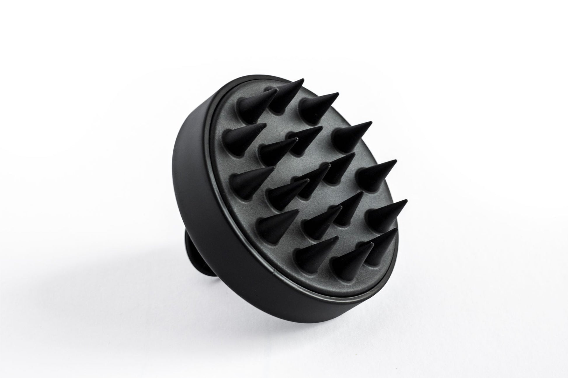 Black scalp massager head with flexible massage nubs