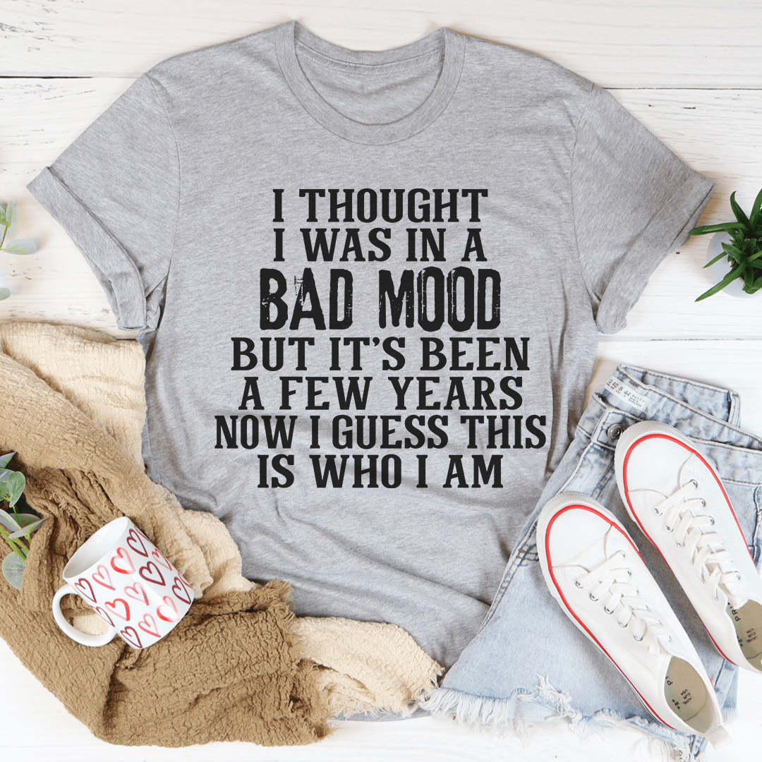 Unisex graphic T-shirt in heather gray featuring centered bold black text slogan