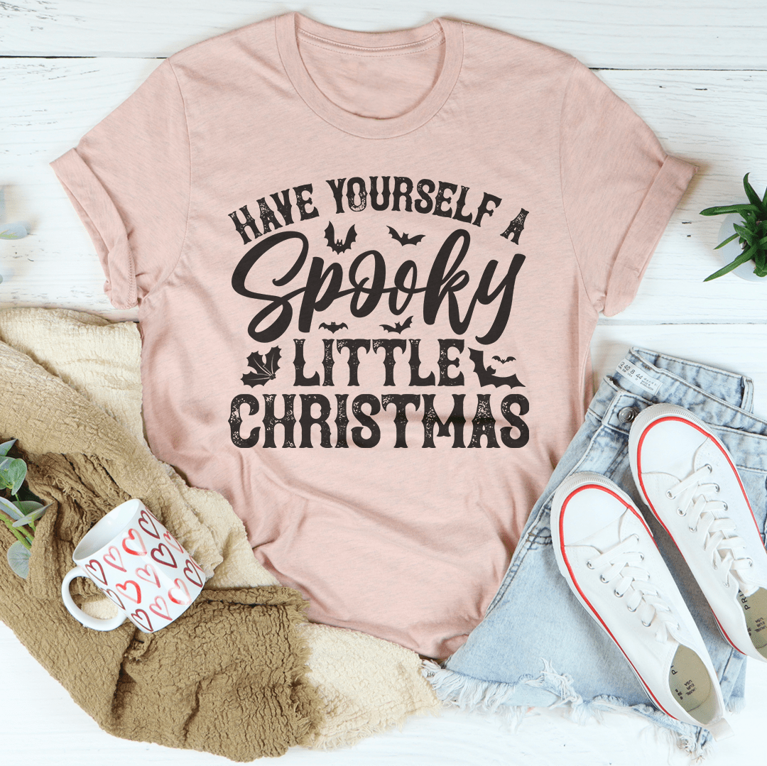 Blush pink Christmas T-shirt with 'Have Yourself a Spooky Little Christmas' typography graphic