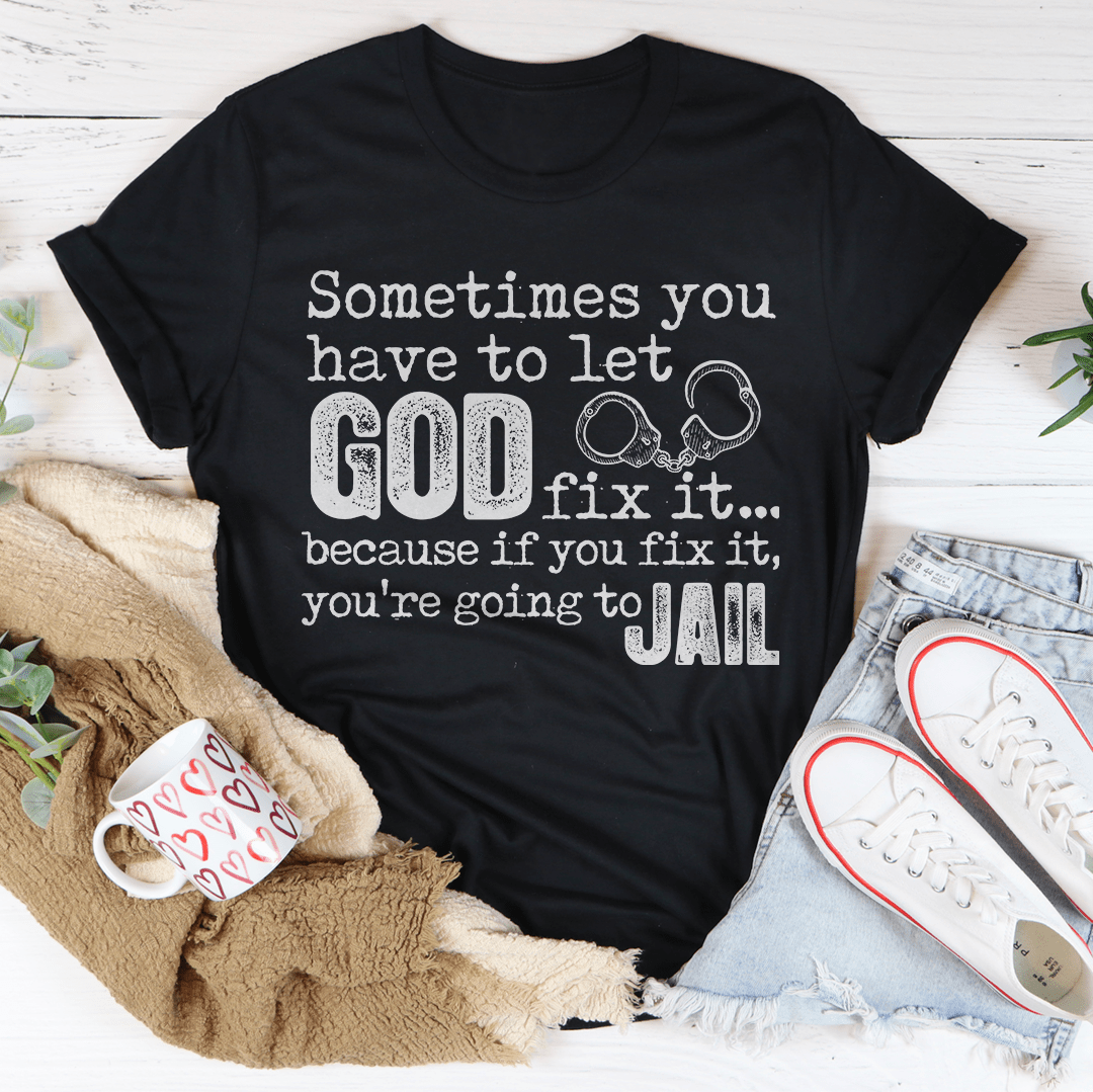 Black crew-neck T-shirt with 'GOD fix it...' and 'JAIL' graphic print