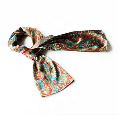 Silk scarf with multicolor paisley and polka-dot print, tied in a bow
