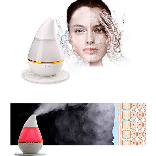 White aromatherapy humidifier diffuser with warm ring and red glowing top