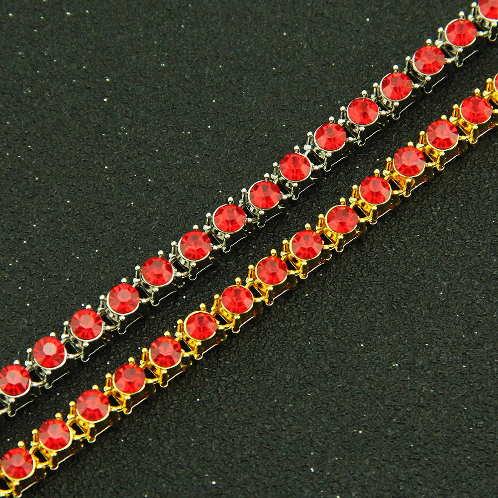 Red rhinestone link bracelet with gold-tone settings and round stones