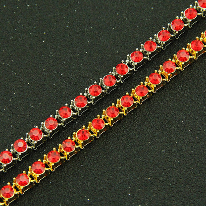 Red rhinestone link bracelet with gold-tone settings and round stones