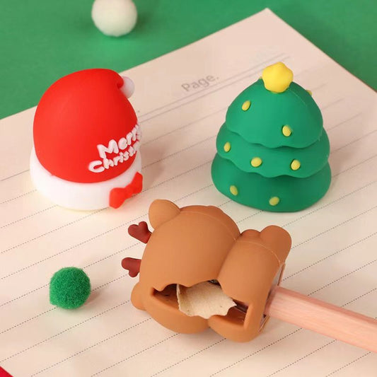 Christmas pencil sharpener set with Santa hat, pine tree, and bear figures