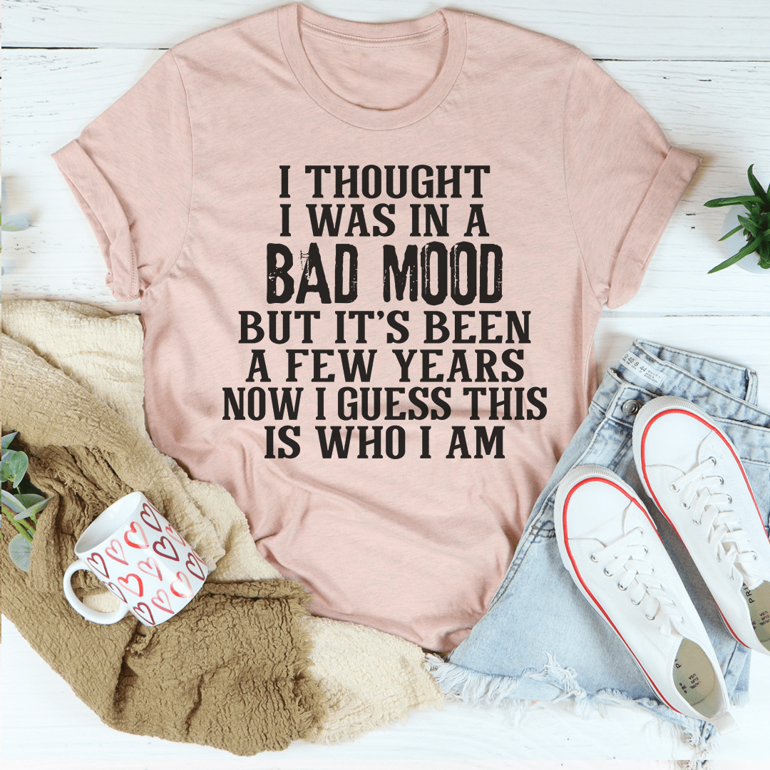 Unisex graphic T-shirt in heather pink with bold black text slogan on front