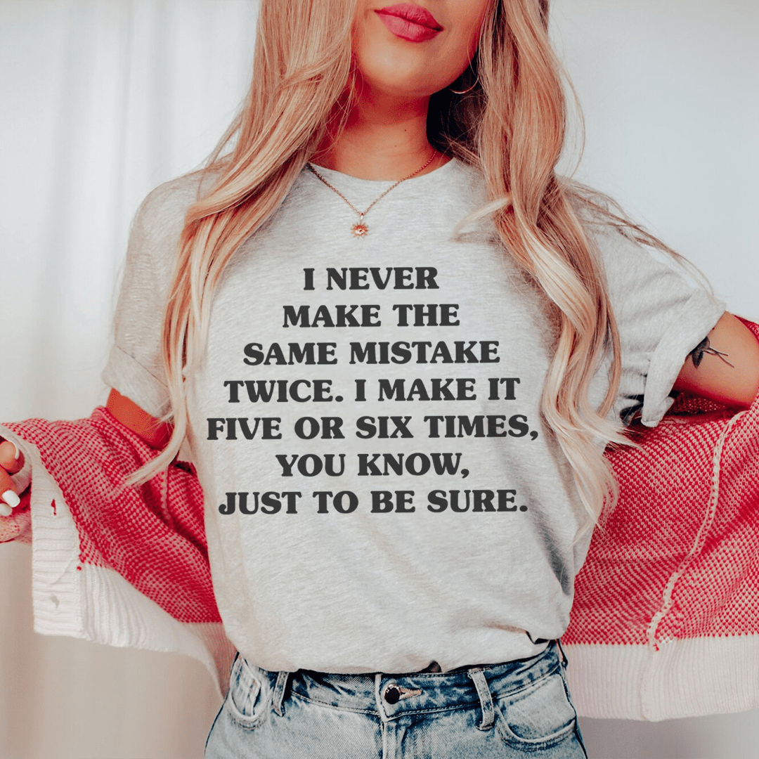 Heather gray graphic T-shirt, crew neck short sleeves, centered black quote text.