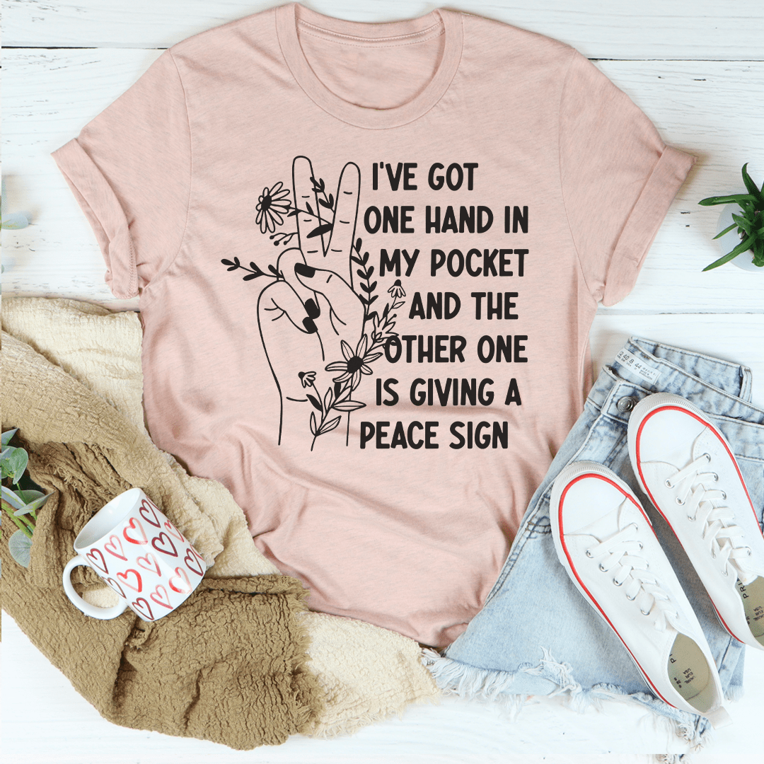 Mauve graphic T-shirt with slogan “one hand in my pocket” and peace sign artwork