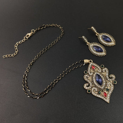 Necklace chain with ornate blue pendant and matching drop earrings set
