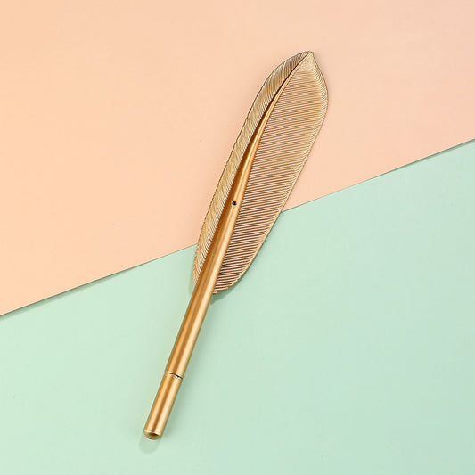 Golden feather gel pen with a metallic gold barrel and fine tip