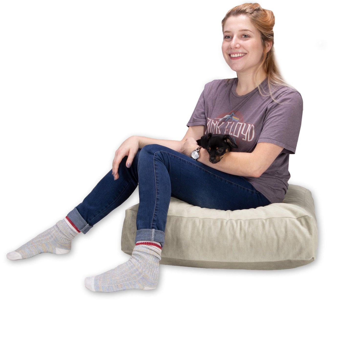 Ivory plush floor cushion used for yoga seating, rectangular bolster shape