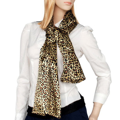 Leopard-print scarf worn at neck with loose ends and bow knot