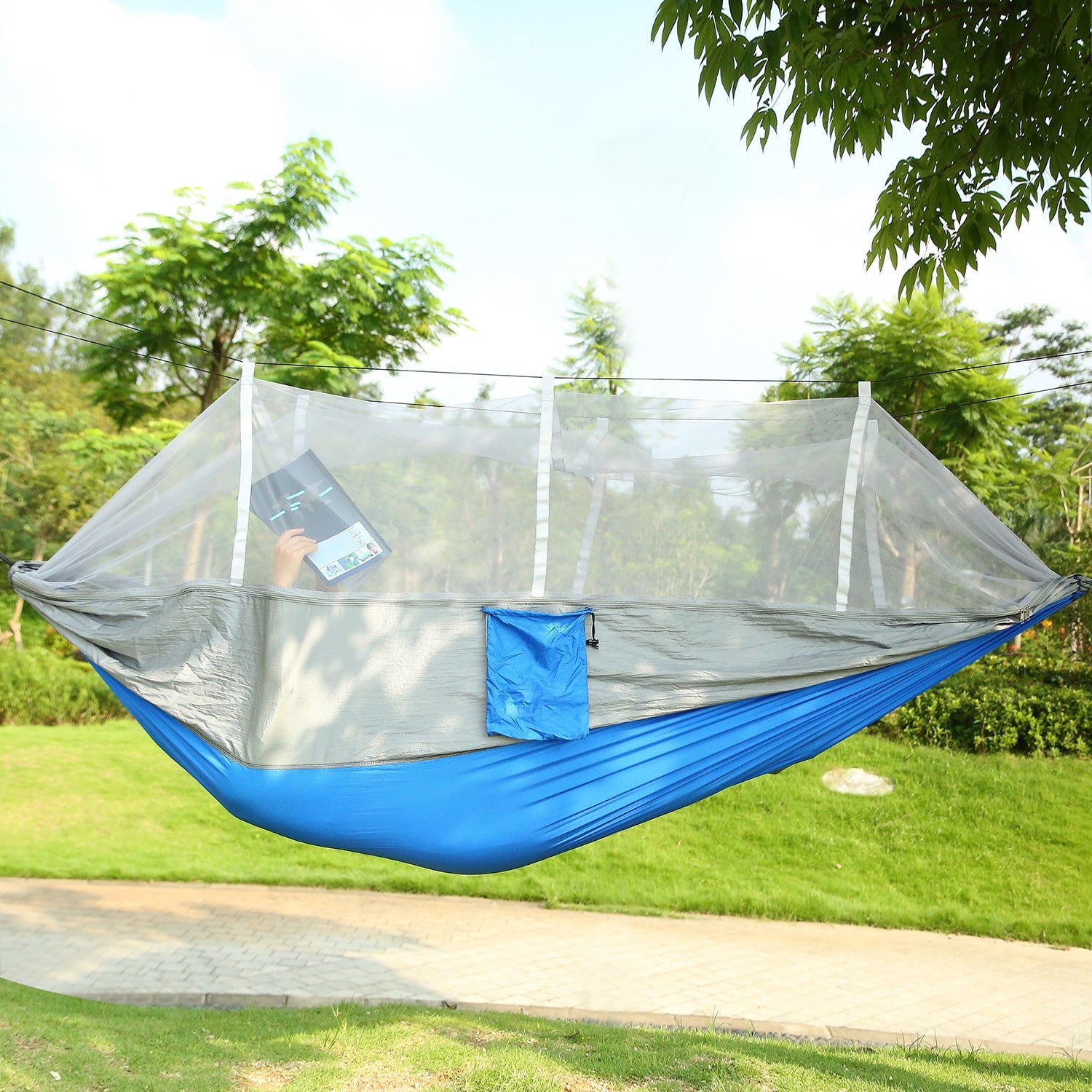 Outdoor mosquito-net hammock swing with blue base and clear mesh canopy