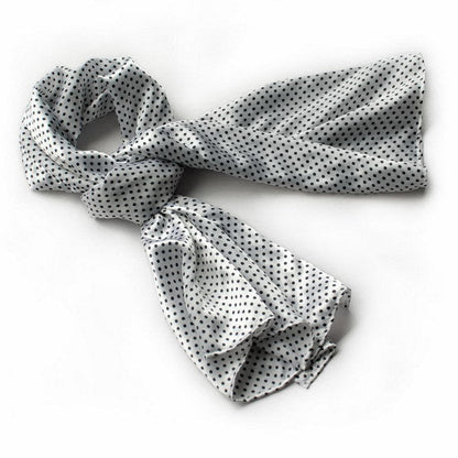 White polka-dot silk scarf with black dots, knotted ends