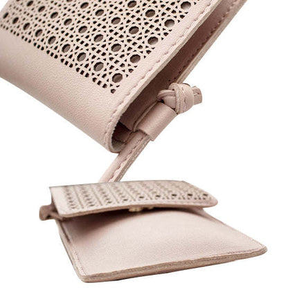Mini transparent phone and card holder bag, close-up of perforated flap and strap loop