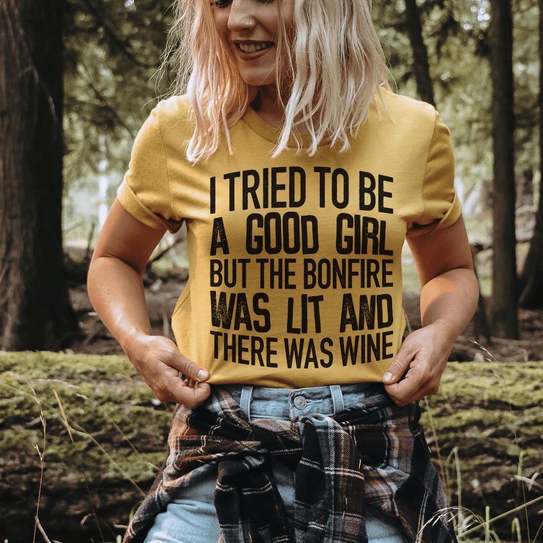 Mustard yellow graphic crewneck T-shirt with black text: “I TRIED TO BE A GOOD GIRL”