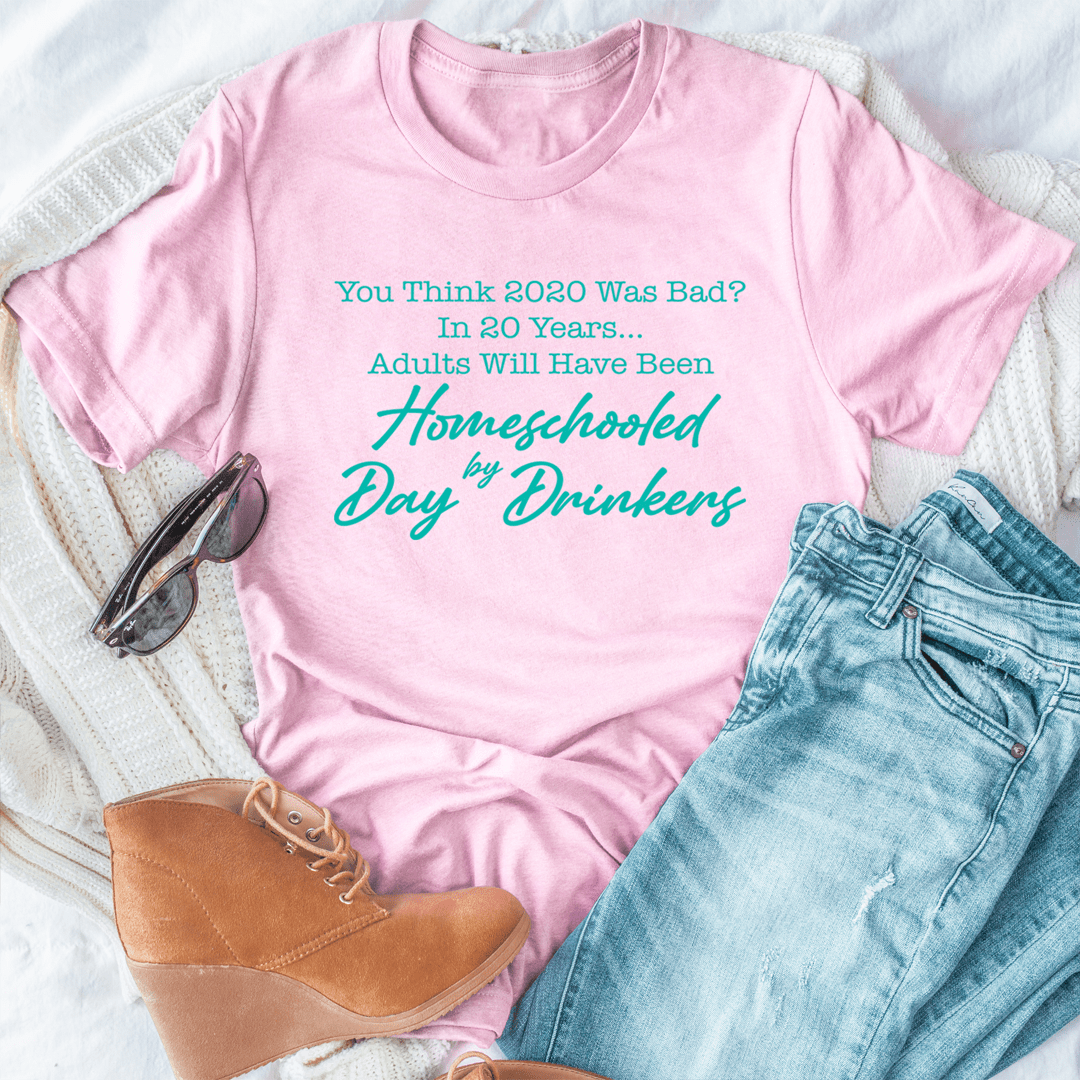 Pink T-shirt with homeschool day drinkers graphic slogan in teal and green