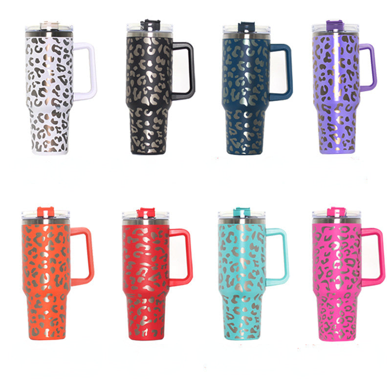Assorted leopard-print travel water tumblers with handles and straw lids