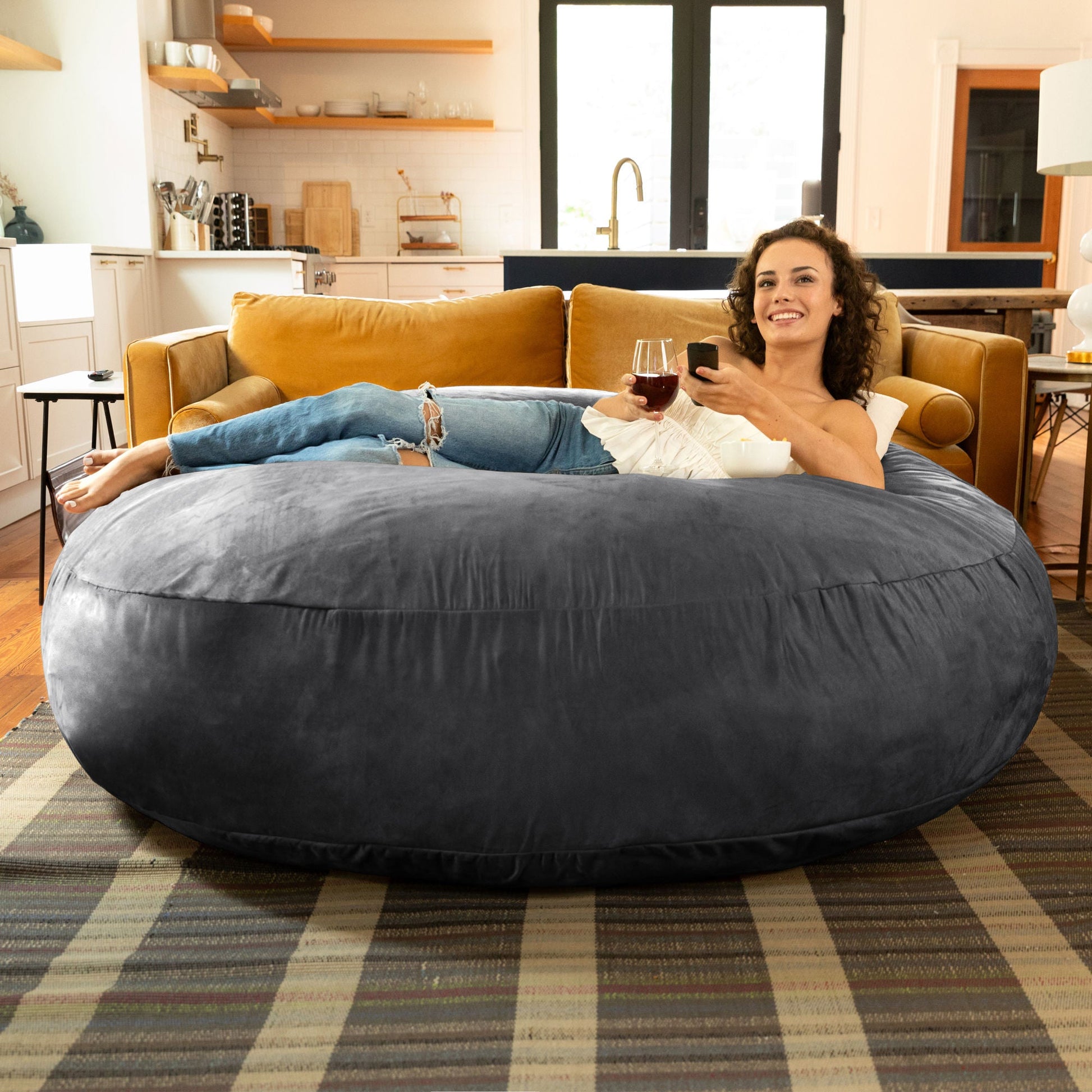Black cocoon bean bag chair, large oval form in microsuede fabric