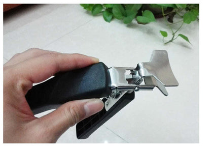 Hot pot picker with dark foam handle and silver spring prongs