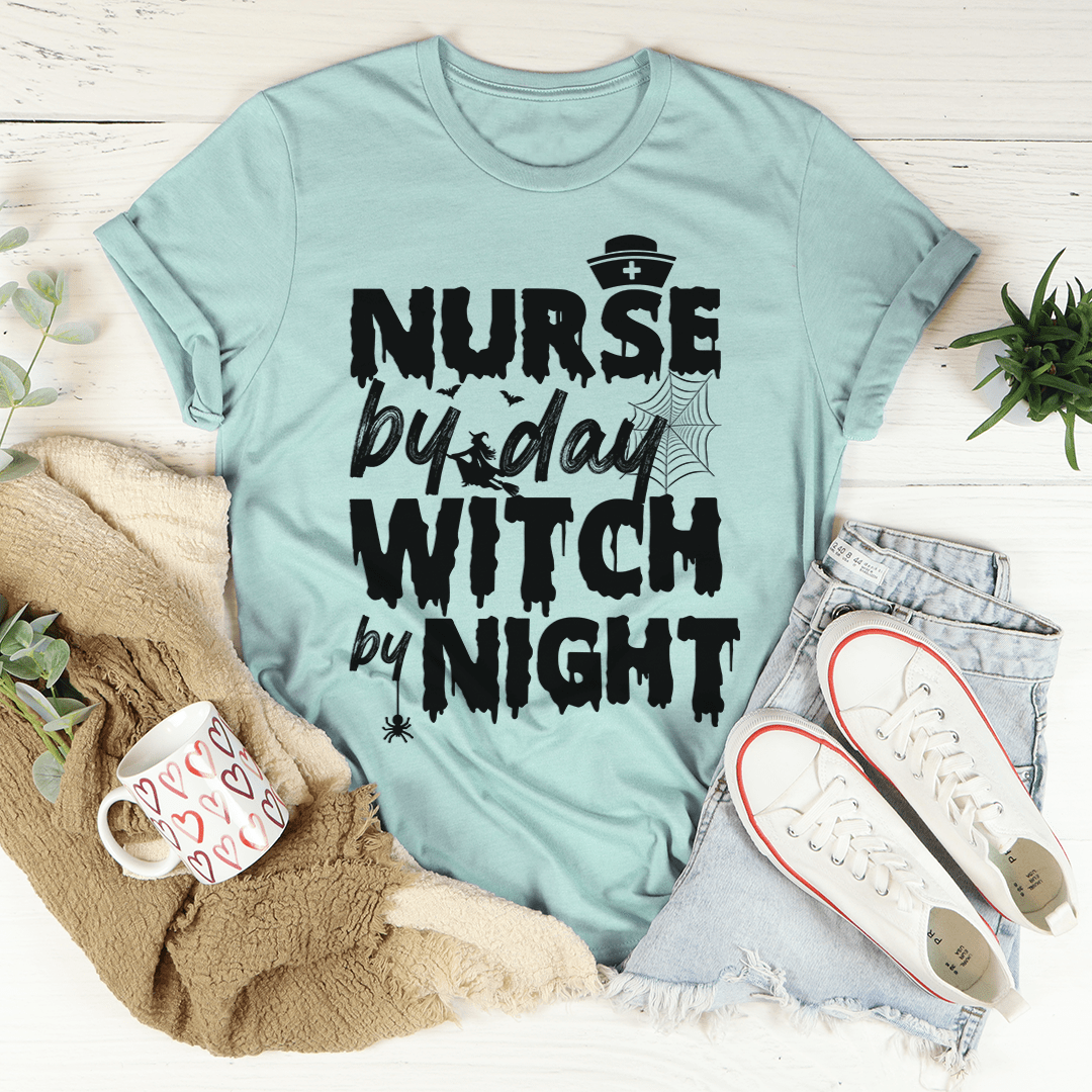 Dusty blue crew-neck graphic t-shirt with “Nurse by day Witch by night” print.