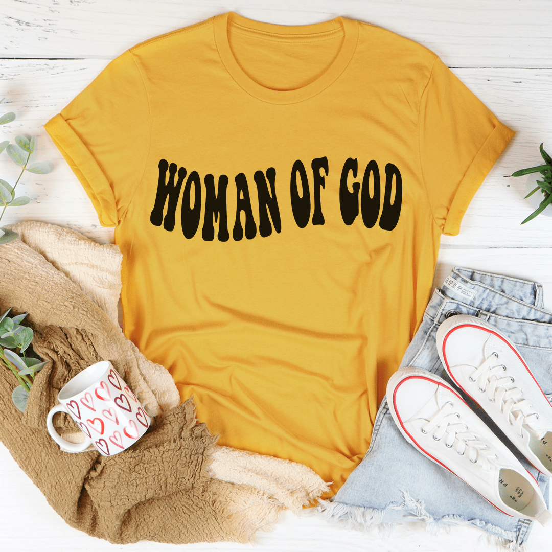 Mustard yellow women’s graphic T-shirt with “Woman Of God” lettering on front