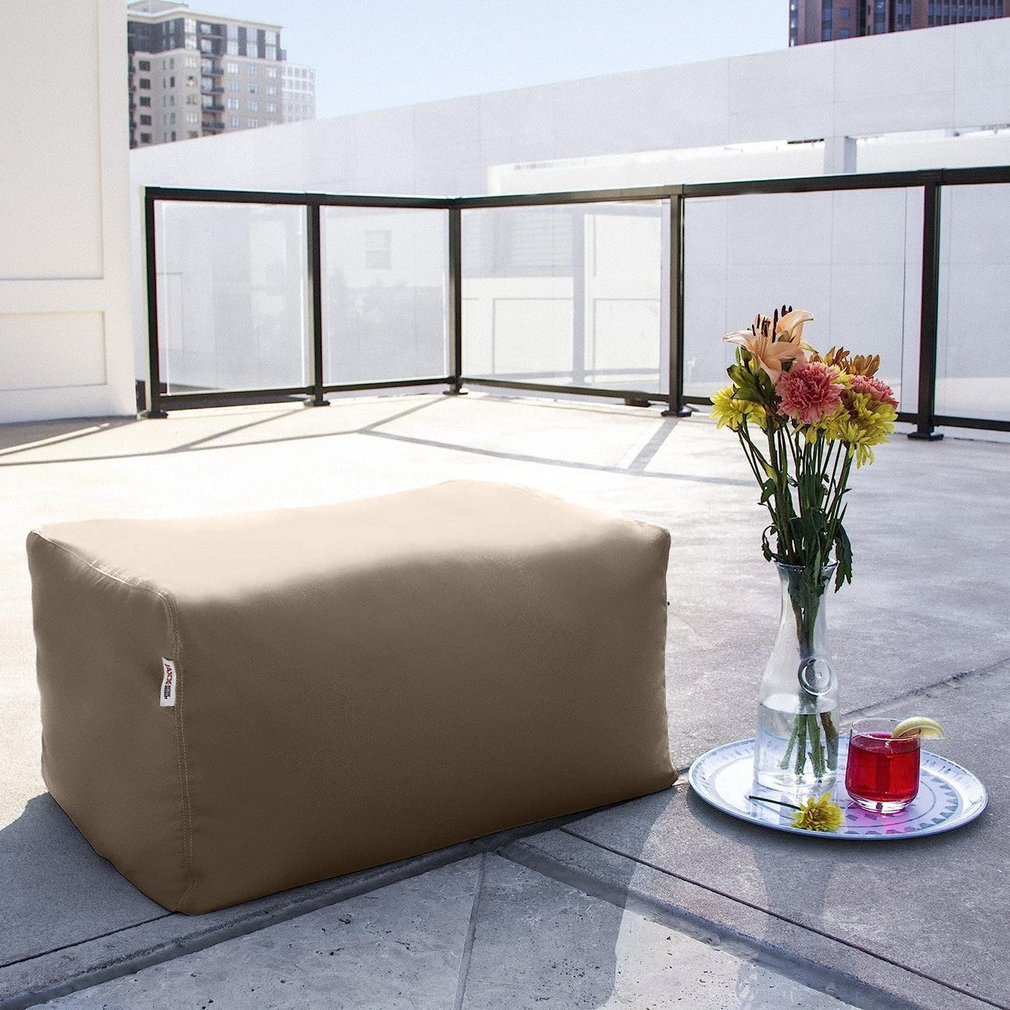 Taupe bean bag ottoman with visible side panel stitching